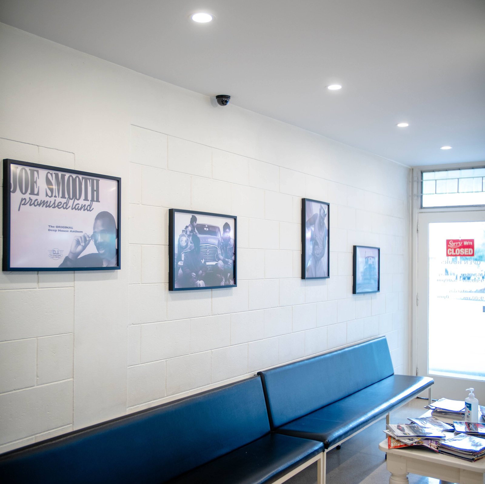 Inside the shop: bench seating and framed prints